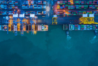 Container,Ship,Loading,And,Unloading,In,Deep,Sea,Port,,Aerial